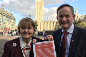 Baroness Caroline Cox and John Pontifex with the petition © ACN