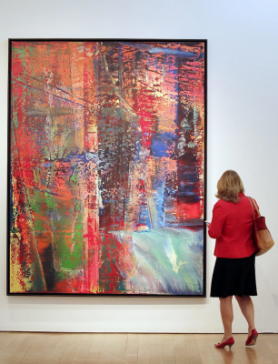 Woman looking at 'Abstraktes Bild, Dunkel' by Gerhard Richter during preview of a post-war & contemporary art auction at Christie's, NY. 3.05.2013 © UPI / Alamy Stock Photo