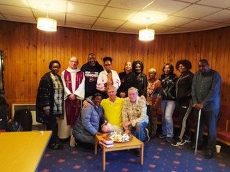 CAPS' Positive Faith Ministry. Back: l-r: Adela Senkubuge; Fr Peter Kinsella; Rev Jide Macaulay; Front right:  Dr Vincent Manning