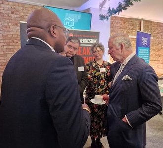 l-r:  Fr Alfred Ebalu, Fr Dominic Robinson, Dr Caroline Hull and King Charles III © ACN