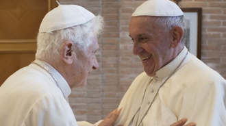 Pope Emeritus Benedict pictured greeting Pope Francis on his 91st birthday in 2018.