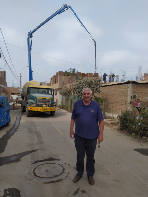 Fr Ed  in front of Sacred Heart Church as roof was added on 17th December