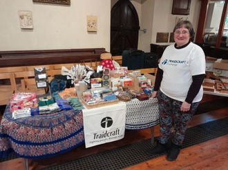 Marion Hill, parishioner at Haverstock Hill Parish, with her Traidcraft stall