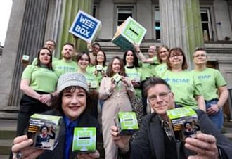 Ricky Ross and Lorraine Lorraine McIntosh from Deacon Blue with SCIAF staff. By Colin Hattersley