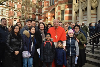 Family poses with Cardinal Vincent outside Cathedral. Image: M Mazur CBCEW