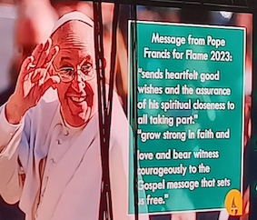 Pope Francis on screen at Flame. ICN