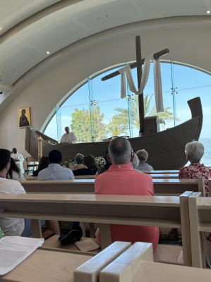 Rev Patrick preaching from the 'altar-boat' in Duc in Altum Church