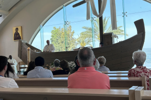 Rev Patrick preaching from the 'altar-boat' in Duc in Altum Church