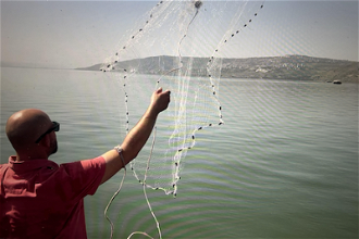 Casting a net on the Sea of Galilee