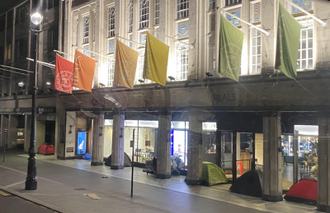 Eight tents shelter for the night next to one West End department store. Image: ICN/JS