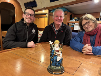 Steve Willow, Russ Fareman and Jo Siedlecka on board with statue of Our Lady of Walsingham