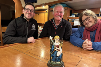 Steve Willow, Russ Fareman and Jo Siedlecka on board with statue of Our Lady of Walsingham