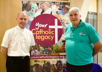 Bishop Paul Mason with Father Ed O'Connell. Image by Weenson Oo