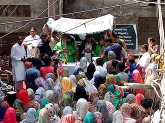 Bishop Indrias Rehmat of Faisalabad presiding at Mass outside the torched St Paul's Church, Jaranwala © Caritas Pakistan Faisalabad