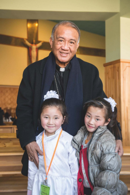Bishop Wens with Mongolian children. Image Missio