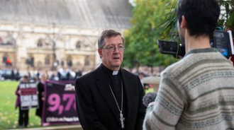 Bishop John outside Parliament