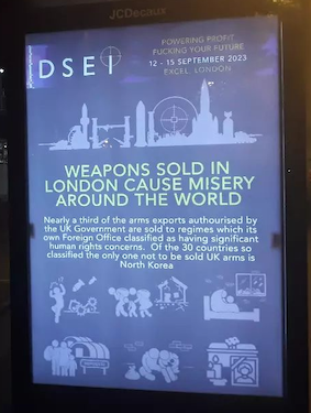 Poster at DSEI Arms Fair