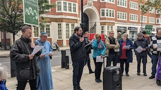 James Trewby leads prayers outside Home Office