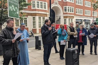 James Trewby leads prayers outside Home Office