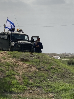 Ominous sight - armed settlers with military jeep watch Susiya - Feb 2022 Image: Jessica_EAPPI