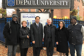 Fr Devine with Dr Gabriel Esteban, President of DePaul University, with faculty staff, after his lecture on conflict resolution and peace-building