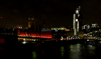 Houses of Parliament floodlit on #RedWednesday