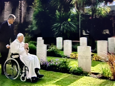 Pope Francis visits some of the graves in Rome's Military Cemetary. Image Vatican Media.
