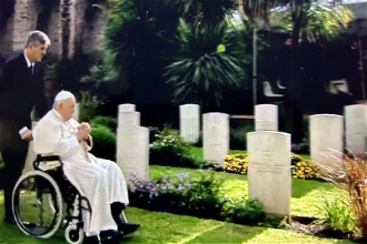 Pope Francis visits some of the graves in Rome's Military Cemetary. Image Vatican Media.