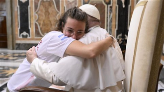 Pope Francis hugs young girl from Argentina. Image Vatican Media