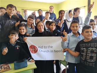 Pupils and teacher at school run by Good Service Sisters in Lebanon © ACN