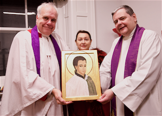 l-r: Canon Wright, Dr Irina Bradley and Fr Robinson SJ with the  icon of St Claude La Colombiere