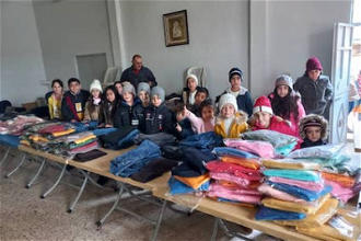 Children receiving Christmas gifts in Syria © ACN