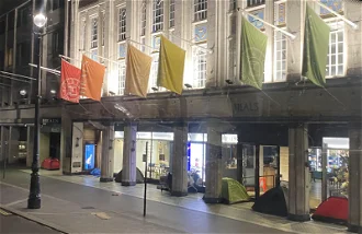 Eight tents shelter for the night next to one West End department store. Image: ICN/JS