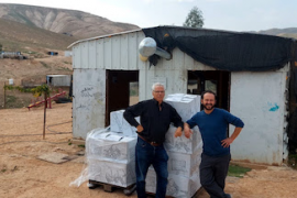 Rabbi Dani Danieli and Anton Goodman of RHR deliver aid to communities in South Jordan Valley.