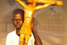 ...Sudanese boy with cross... Image: ACN