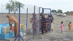 queueing for water. Image: CAFOD
