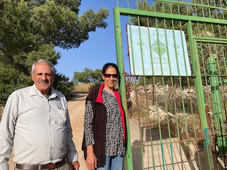 Daher and Amal Nassar at Tent of Nations entrance - May 2024 visit during ICAHD's study tour