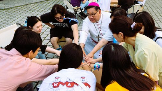 Archbishop Peter with young people. Image  Communications Committee, Archdiocese of Seoul