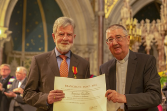 Archbishop Diarmuid Martin conferring Justin Kilcullen with Order of Saint Gregory in 2019.