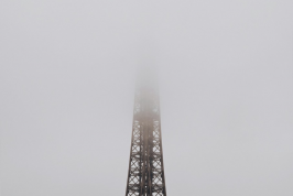 Eiffel Tower on a foggy morning. Photo by Daryan Shamkhali on Unsplash