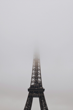 Eiffel Tower on a foggy morning. Photo by Daryan Shamkhali on Unsplash