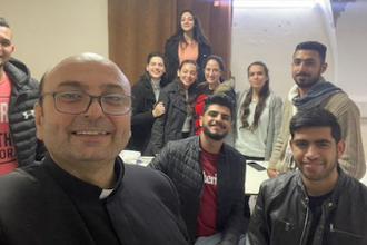 Fr Gabriel in selfie with some parishioners