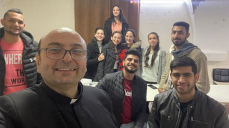 Fr Gabriel in selfie with some parishioners