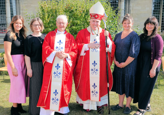 Father John Morrill  and his four daughters with Bishop Peter Collins. Image Diocese of East Angla