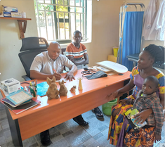 Fr Avelino with visitors in Ave Maria parish office