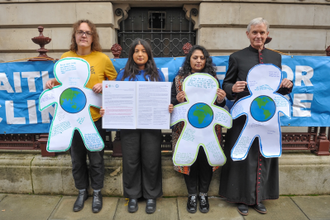 Faith representatives with Canon Giles Goddard, Chair, Faith for the Climate and Vicar, St John's Waterloo.  Image: Michael Preston for Quakers