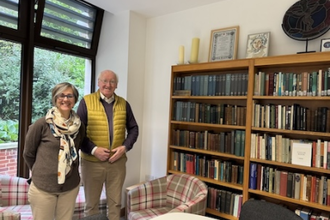 Dr Anna Abram and Kevin, friend of the Newman Association, with Prof Lash's Newman library