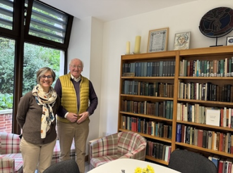 Dr Anna Abram and Kevin, friend of the Newman Association, with Prof Lash's Newman library