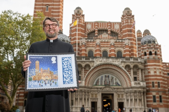 Cathedral Dean Fr Slawomir Witon with the stamp