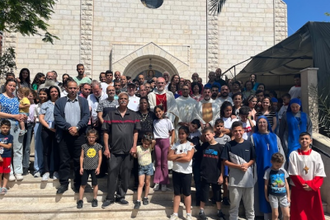 Cardinal Pierbattista with parishioners at Holy Family Parish Gaza, during his May visit